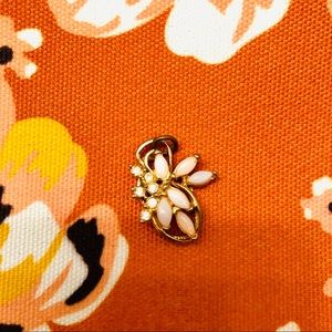 Gold toned necklace charm